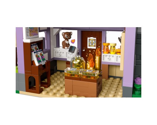 Конструктор LEGO Friends Будиночок і квітник бджолярів (42669)